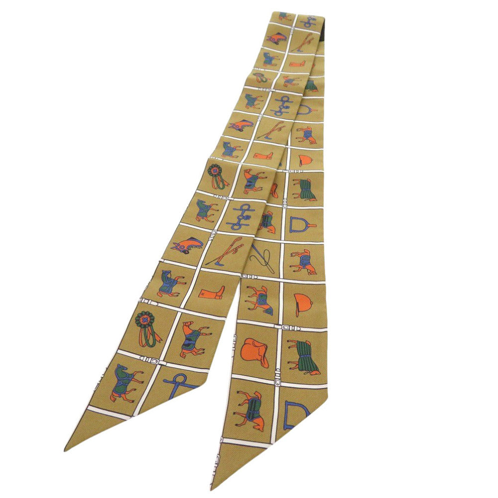 新品同様 エルメス ツイリー Twilly Couvertures et Tenues de Jour シルク オークル カーキ ゴールド マルチカラー 0773【中古】HERMES