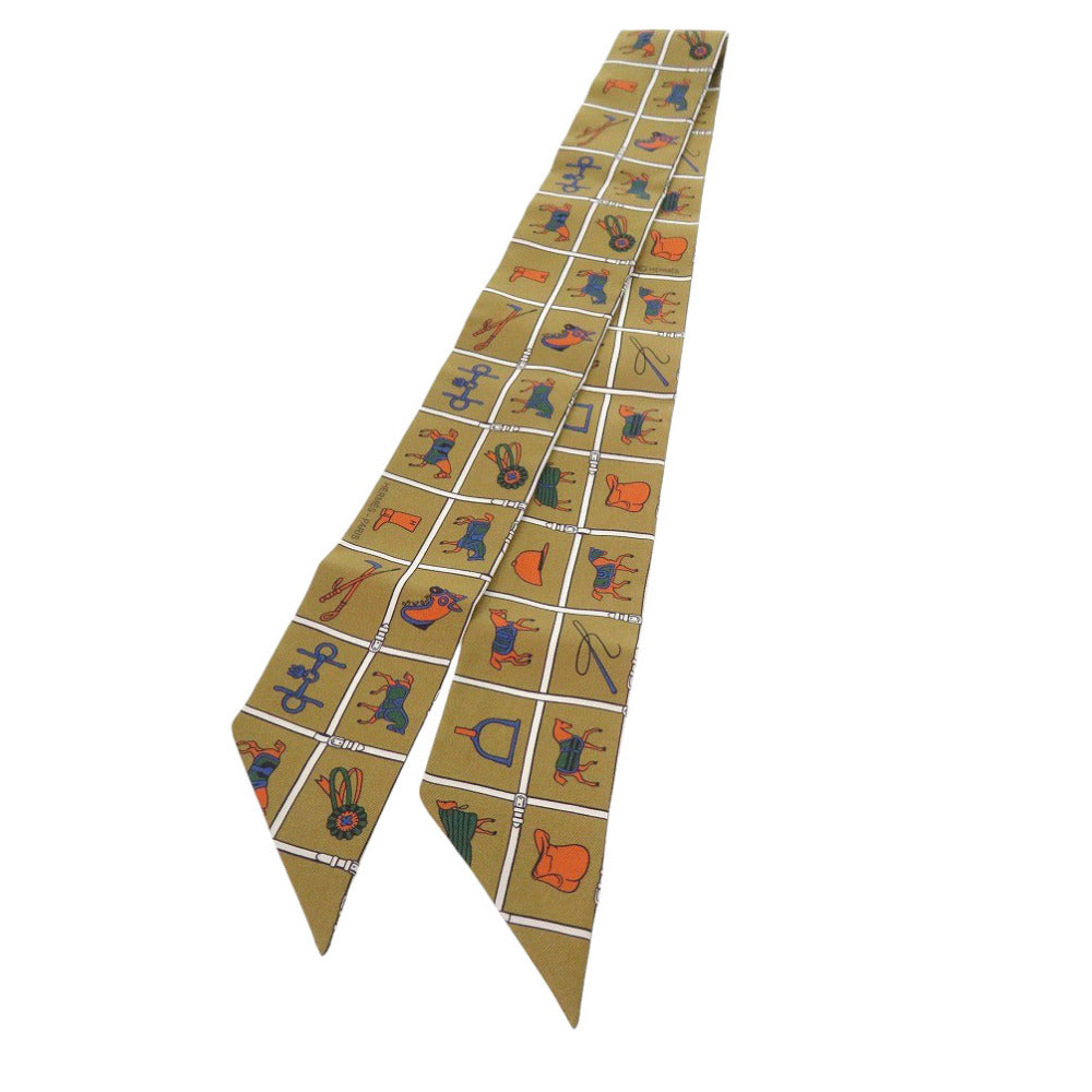 新品同様 エルメス ツイリー Twilly Couvertures et Tenues de Jour シルク オークル カーキ ゴールド マルチカラー 0773【中古】HERMES