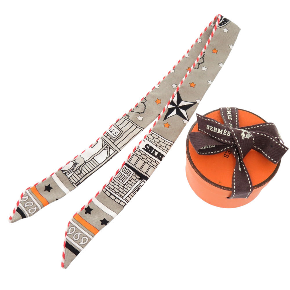 新品同様 エルメス ツイリードール キャンディ パリステーション シルク グリサンドル オレンジ スカーフ 0439 【中古】 HERMES