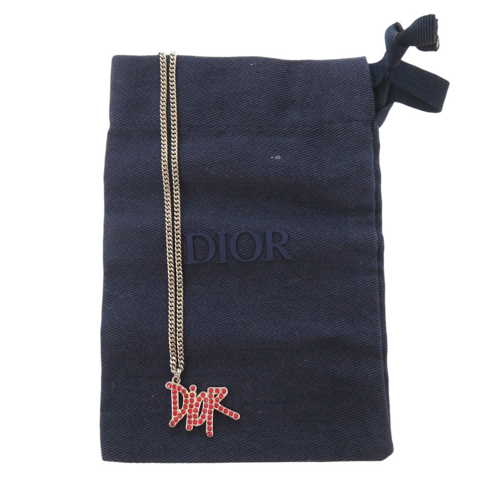 美品 クリスチャンディオール × ショーン ステューシー ロゴ N1386HOMMT メタル ストーン レッド シルバー ネックレス 1446【中古】Christian Dior