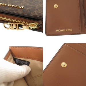 新品同様 マイケルコース EMPIRE エンパイア シグネチャーロゴ スナップ コイン ビルフォールド ミディアム コーティングキャンバス ブラウン 二つ折り財布 0592【中古】Michael Kors