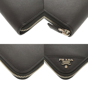 新品同様 プラダ サフィアーノレザー ブラック ラウンドファスナー 長財布 黒 1506【中古】PRADA メンズ