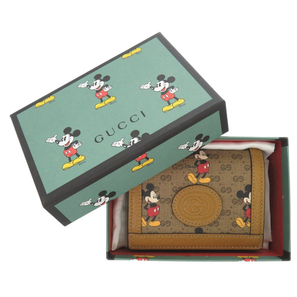 新品同様 グッチ ディズニーコラボ ミッキーマウス 602534 PVC/レザー ブラウン 二つ折り財布 茶 0452【中古】GUCCI