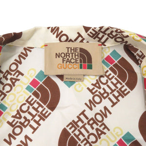 未使用 グッチ × ザノースフェイス THE NORTH FACE 総ロゴ サイズ46 シルク アイボリー系 半袖シャツ 2118【中古】GUCCI メンズ