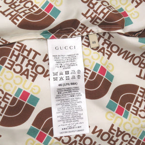 未使用 グッチ × ザノースフェイス THE NORTH FACE 総ロゴ サイズ46 シルク アイボリー系 半袖シャツ 2118【中古】GUCCI メンズ