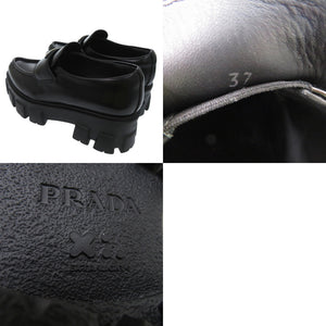 未使用品 プラダ モノリス ポインテッドトゥ ローファー 三角ロゴ トライアングルロゴ 1D663M レザーシューズ レザー NERO 1585【中古】PRADA