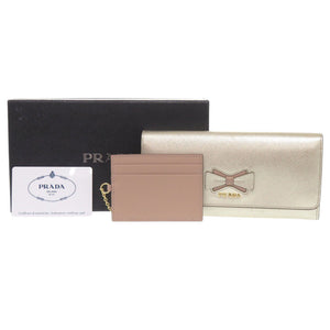 新品同様 プラダ 1MH132 リボン サフィアーノ フィオッコ レザー ゴールド 長財布 0073【中古】PRADA