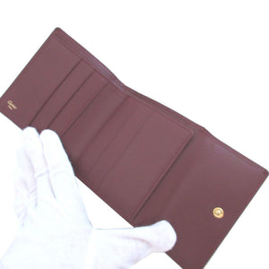 新品同様 カルティエ マスト レザー ボルドー 赤 Wホック財布 財布 0644【中古】Cartier