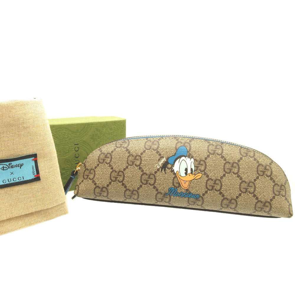 新品同様 グッチ 662129 ディズニー ドナルドダック GGスプリーム ベージュ ブルー 青 ペンケース 筆箱 ポーチ 0071【中古】GUCCI